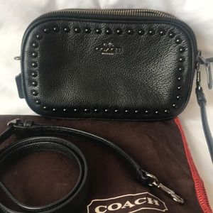 Coach crossbody clutch with lacquer rivets